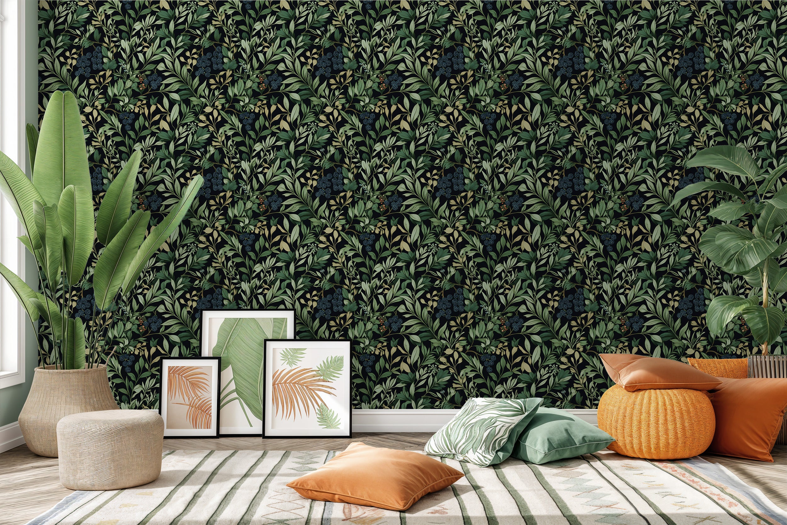 Dark botanical berry wallpaper with green leaves on a black background, room setting with plants and framed prints