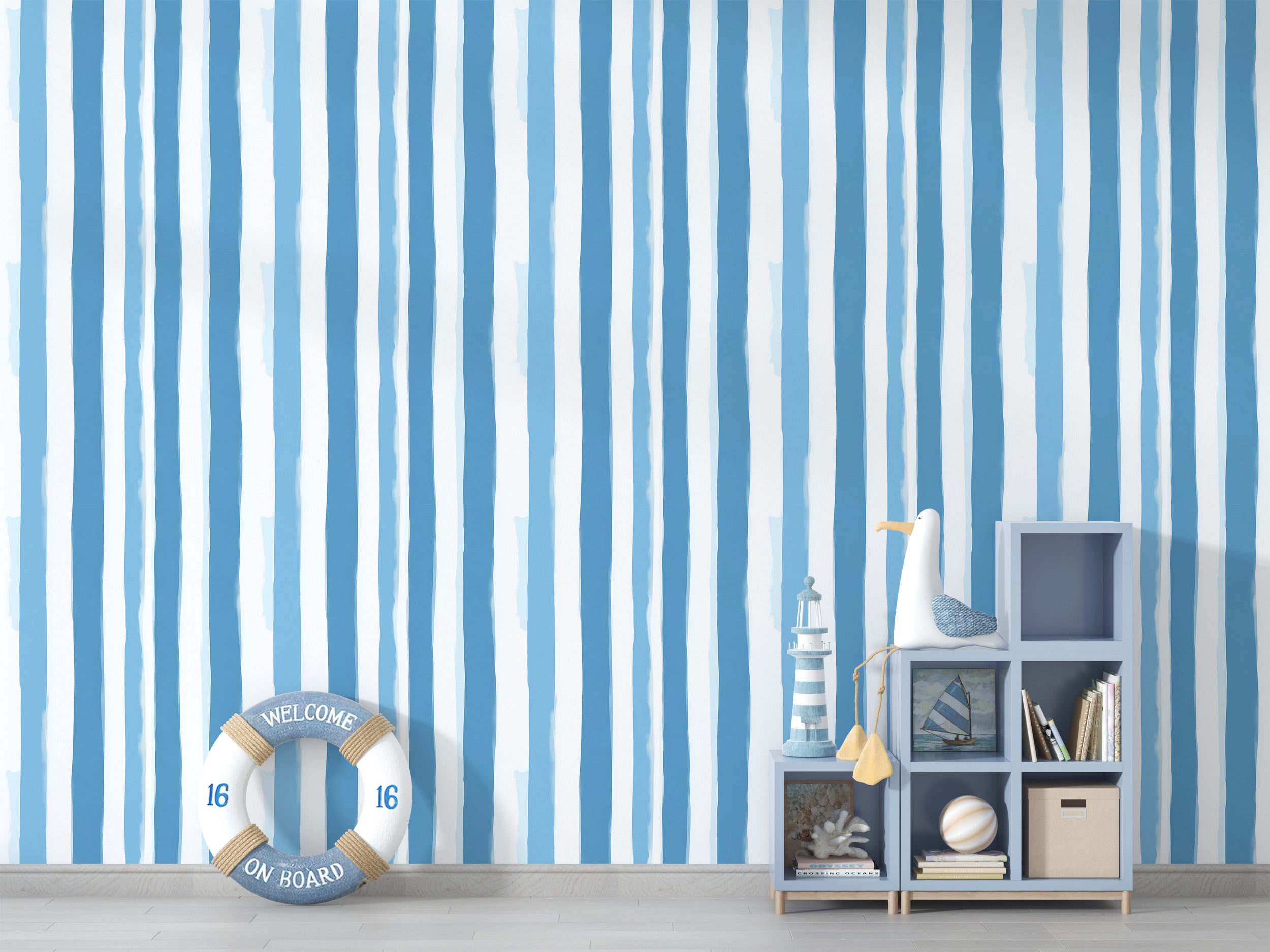 Blue watercolor striped peel and stick wallpaper in a coastal bedroom with light blue and white vertical stripes by storage c