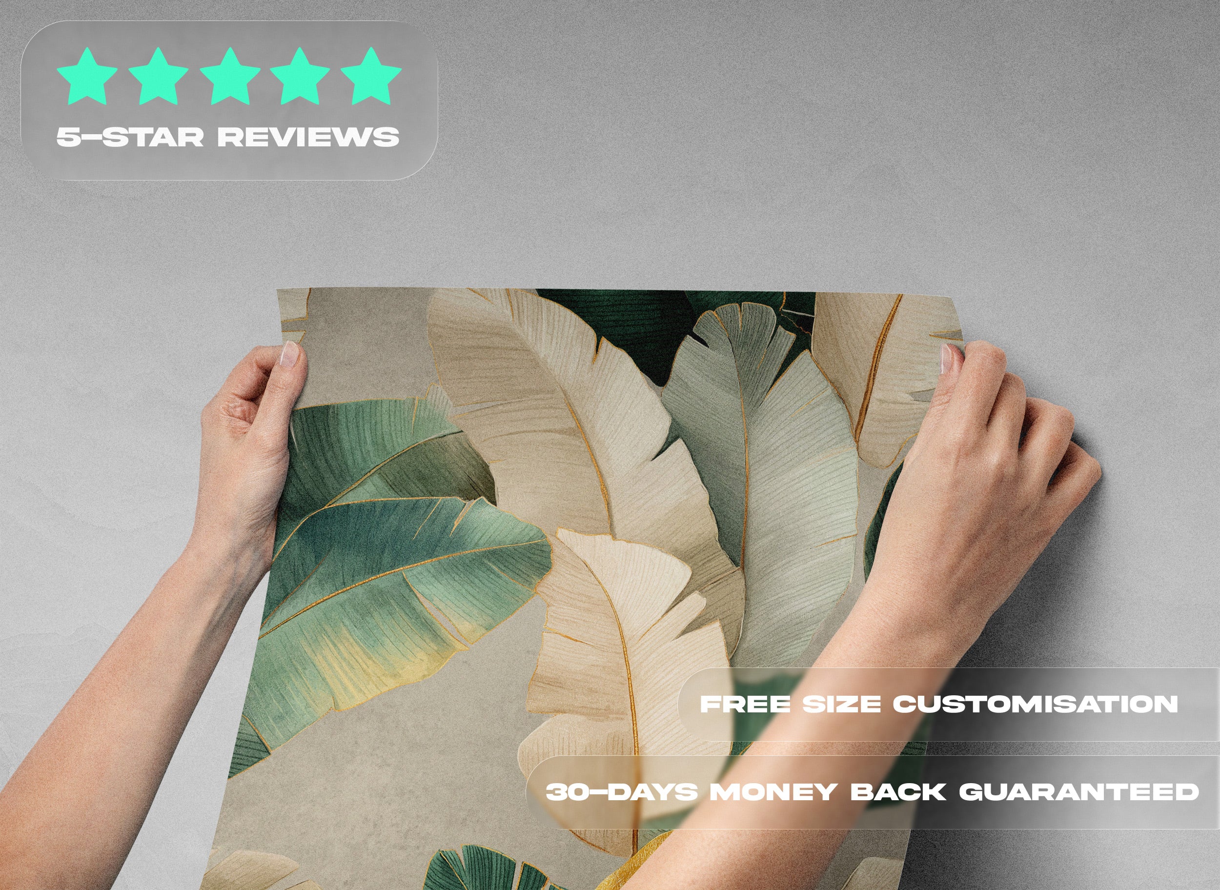 Tropical leaves wallpaper with green and gold botanical pattern being held up by hands in a modern living space with gold accents and a beige