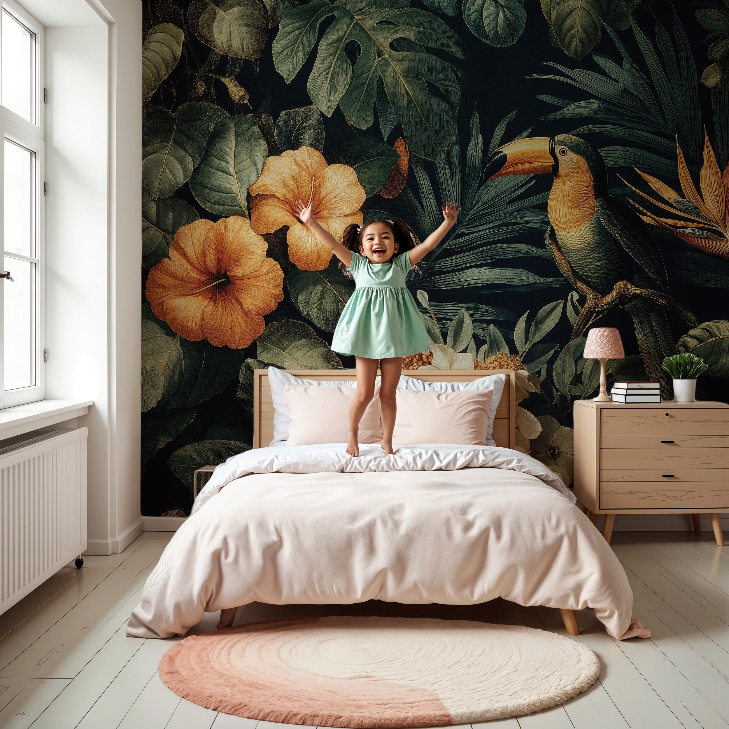 Child jumping on bed in tropical toucan mural room with hibiscus and lush green leaves in a modern bedroom with light furnitu