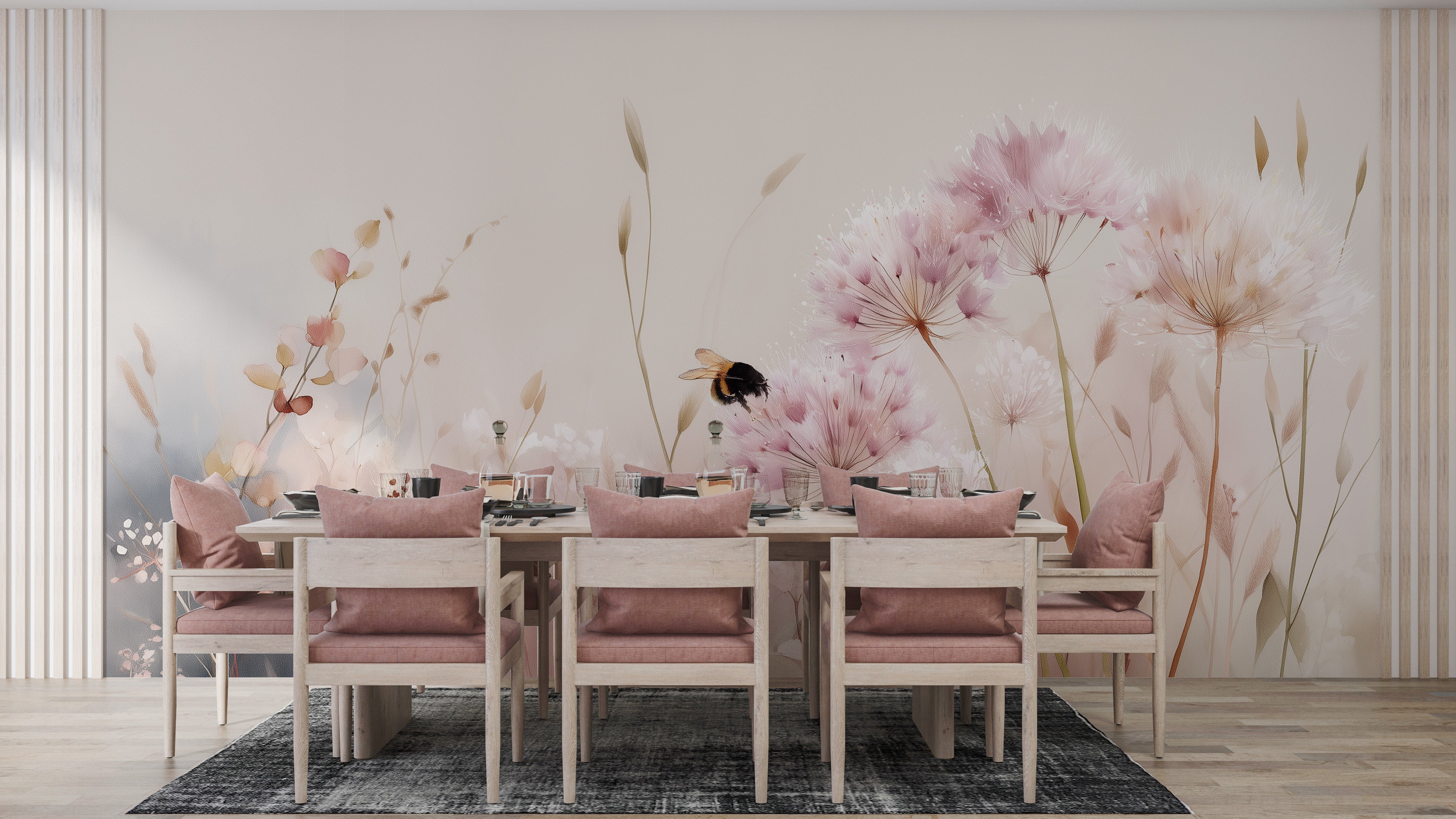 Pink wildflower meadow mural with soft pink dandelions and a bee on a light watercolor wall behind a rustic dining table set