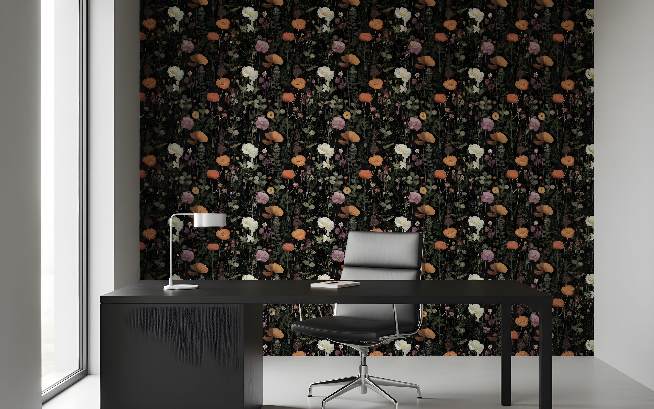 Dark botanical floral wallpaper with black background and vibrant orange, white and pink poppies in a modern black office setting with desk and chair