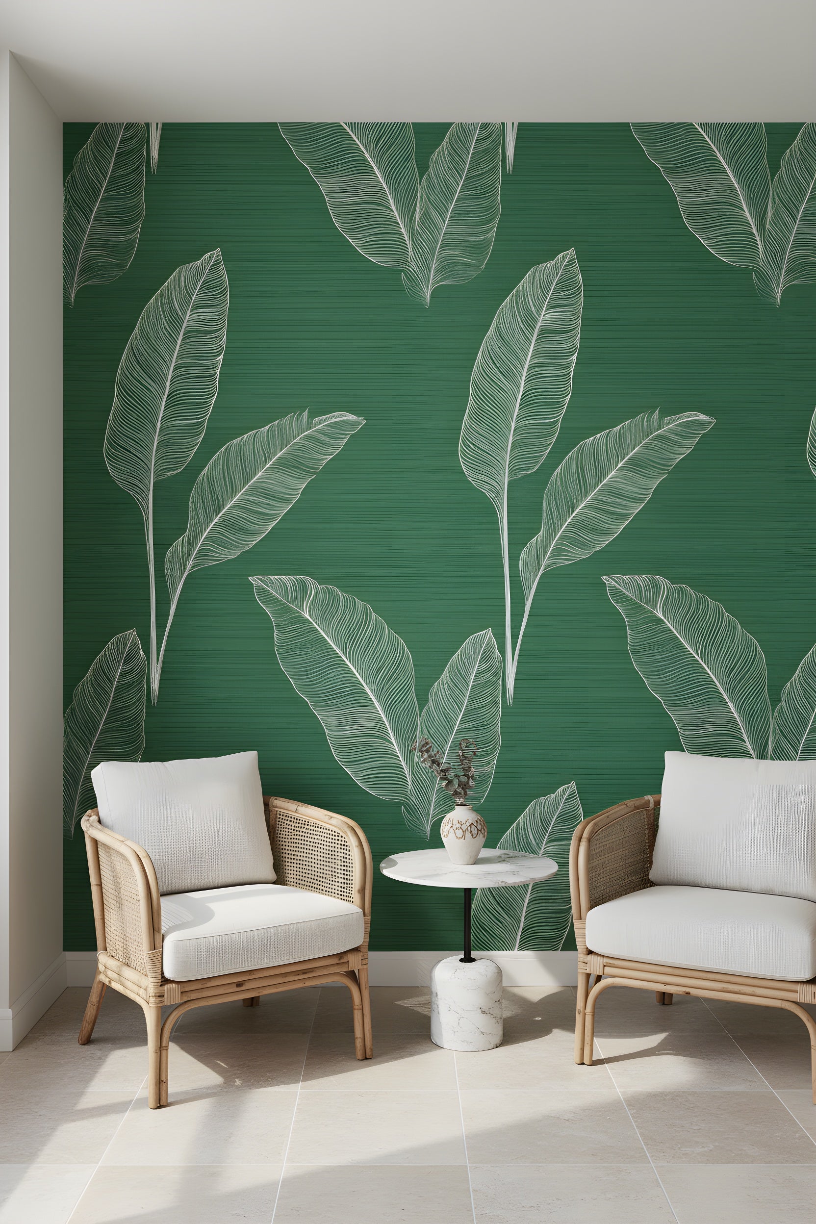 Green tropical leaf wallpaper with white line art in a modern emerald green textured living room featuring two rattan chairs and a small round marble