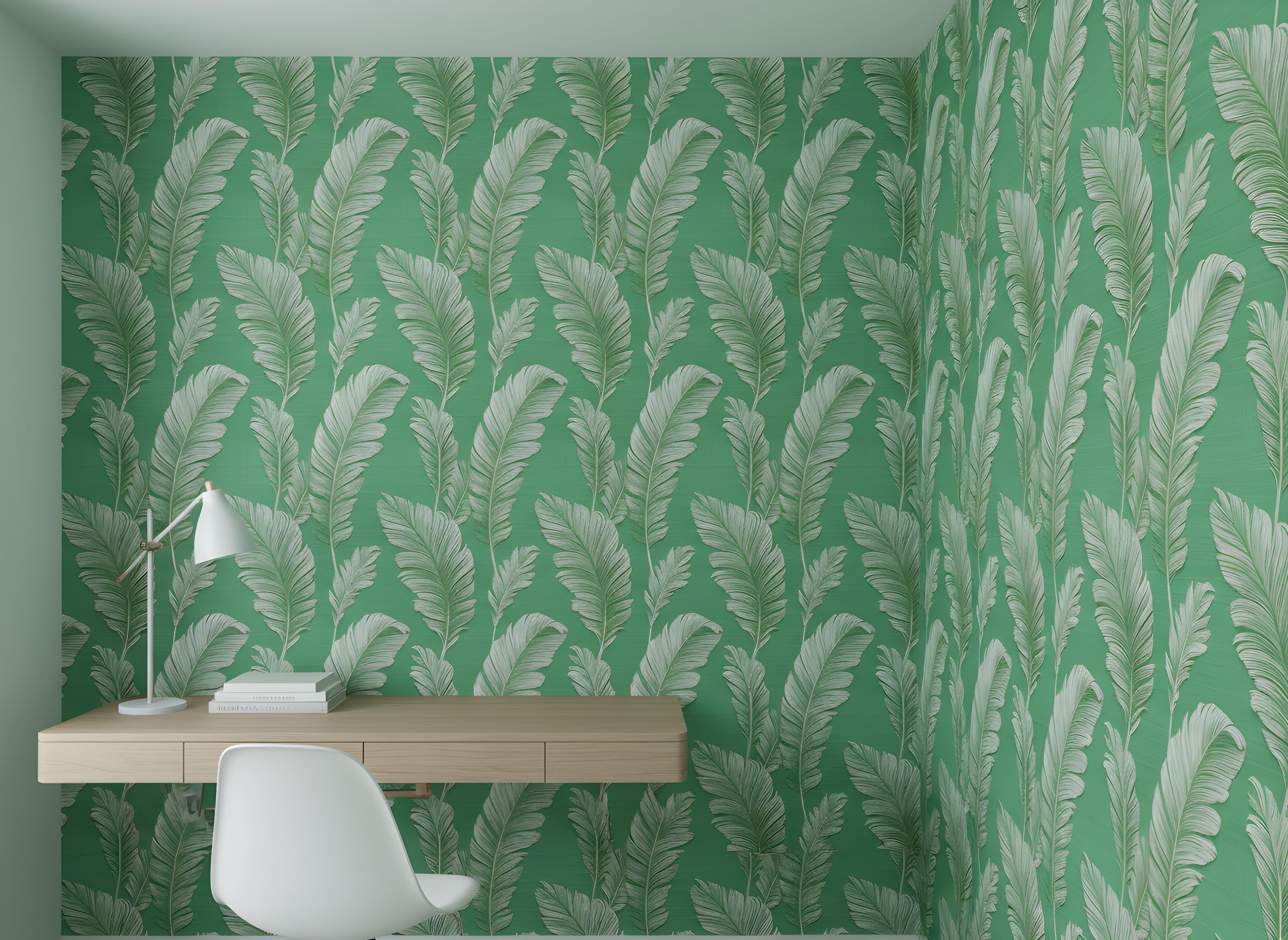 Green palm leaves wallpaper in a bright emerald green room with a light wooden desk, white lamp, and white chair, tropical botanical peel and stick