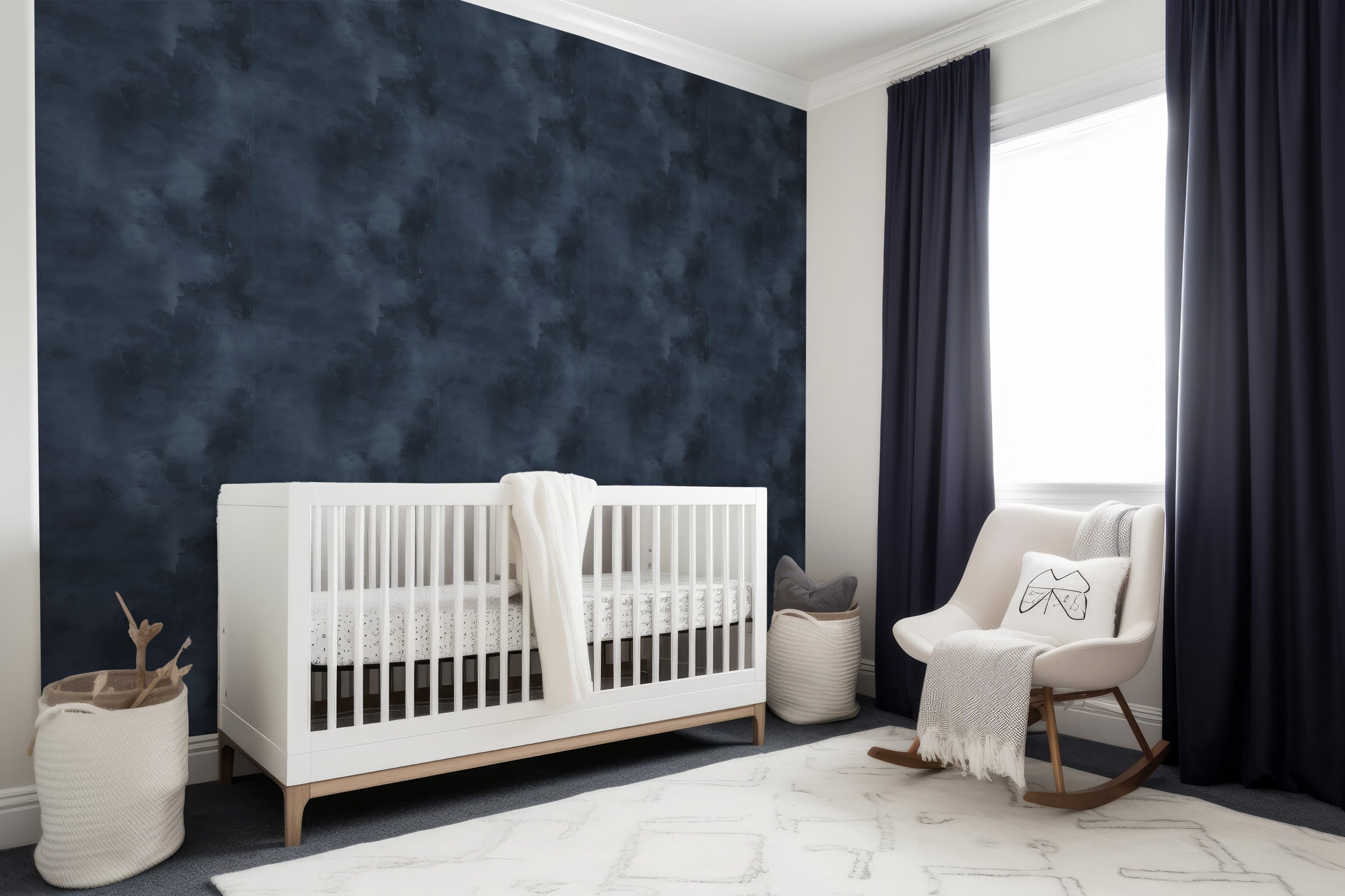 Navy blue abstract textured wallpaper in a modern nursery with a white crib and navy curtains in a bright room