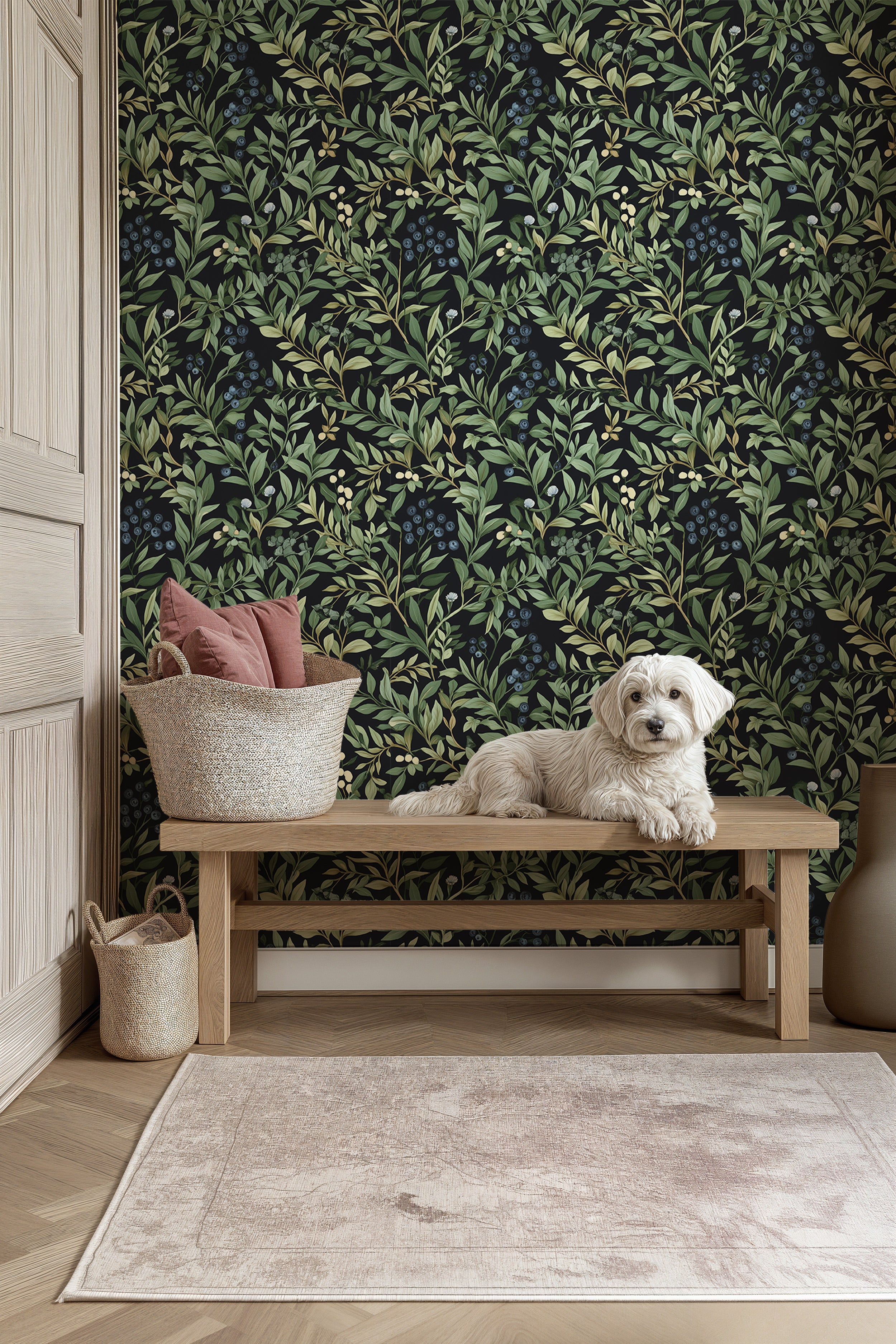 Botanical blueberry pattern wallpaper with green leaves on black background shown in a cozy entry area with a wooden bench an