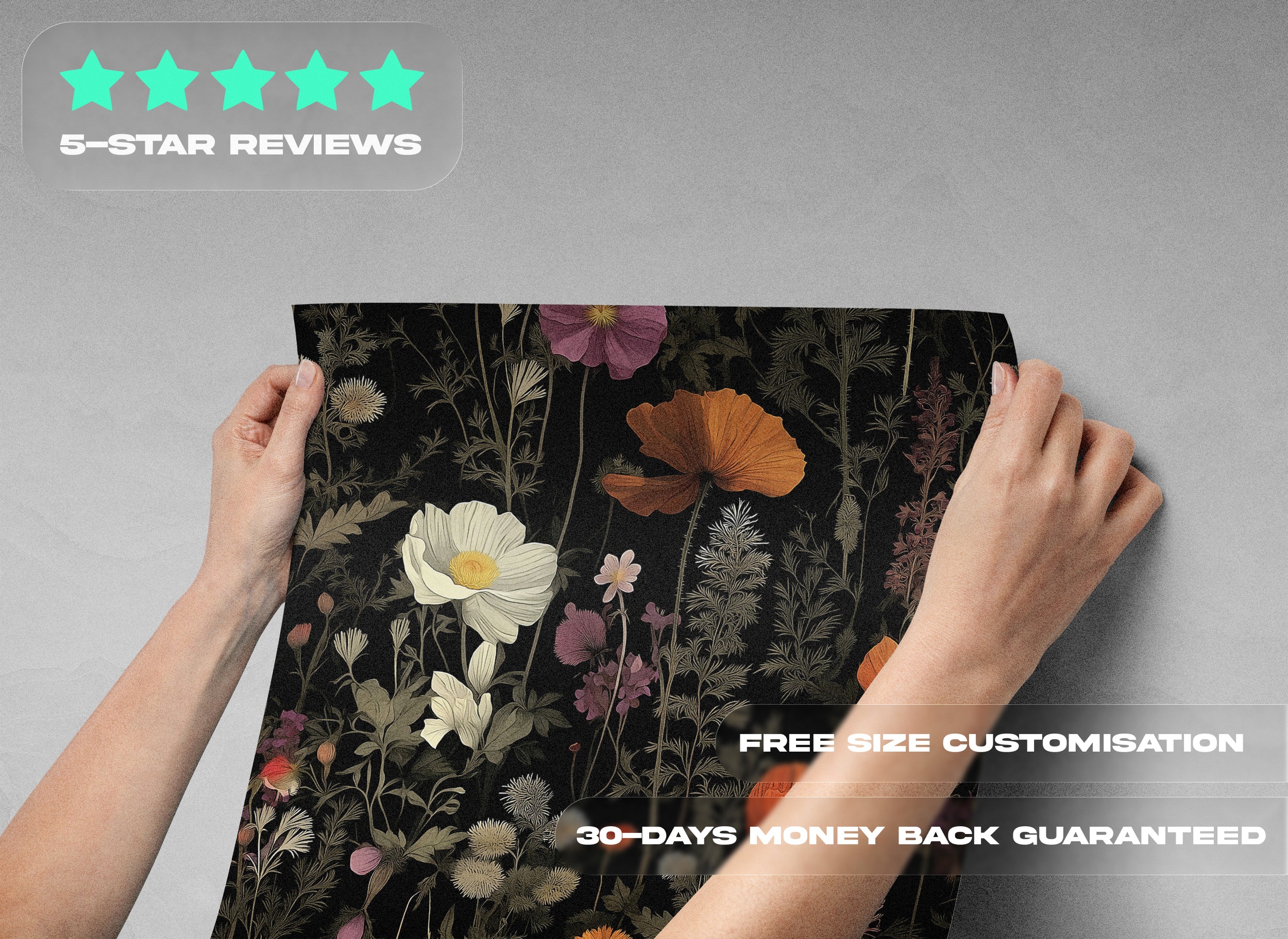 Dark botanical floral pattern wallpaper with orange poppies on a black background being held up for display, featuring hand-drawn flowers and moody