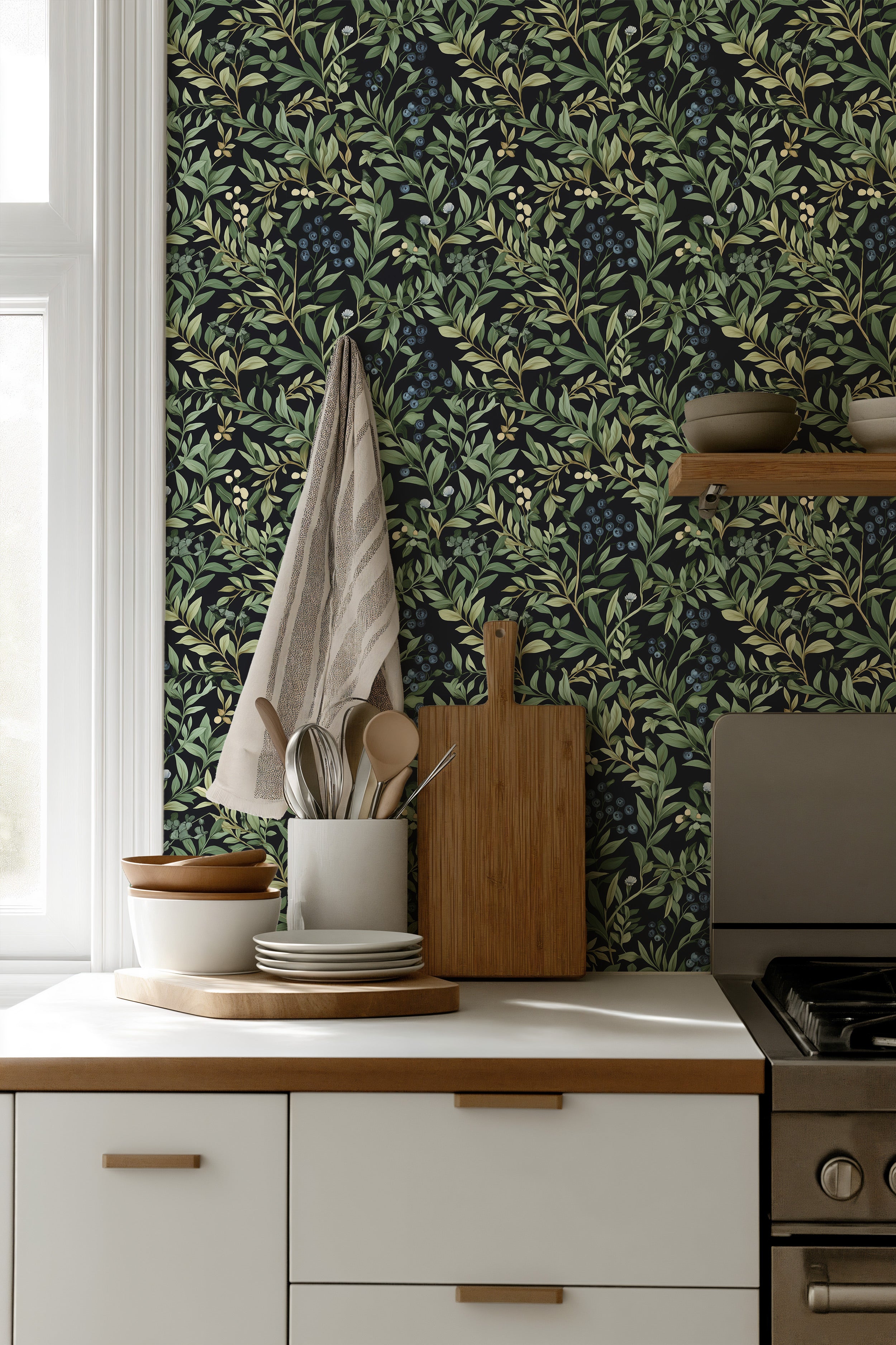 Kitchen with black background botanical blueberry pattern wallpaper featuring green leaves and blueberry clusters behind whit