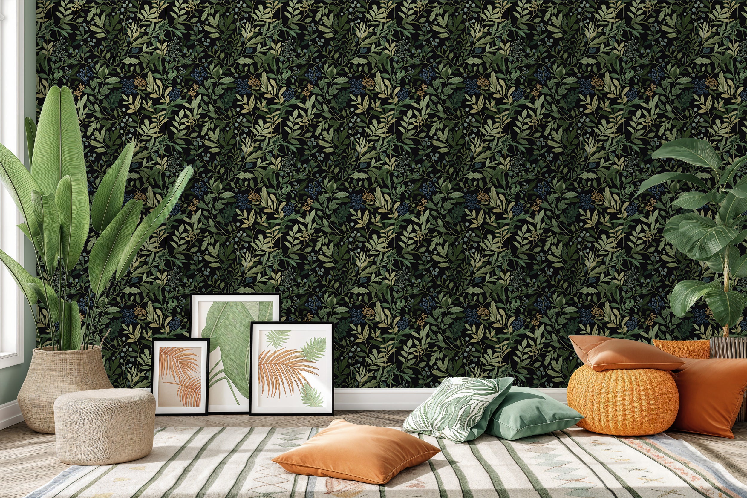Botanical berry wallpaper with dark background and green foliage in a cozy living room with tropical plants and framed prints