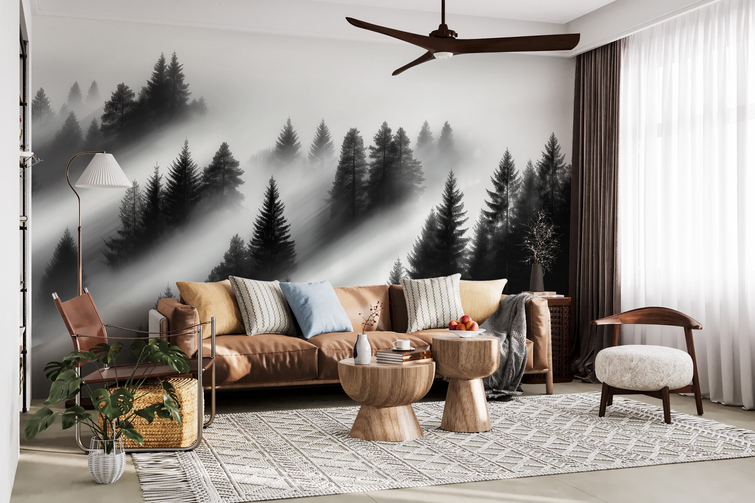Misty forest mural in a living room with black and white evergreen trees, fog shadows behind a neutral sofa and modern decor
