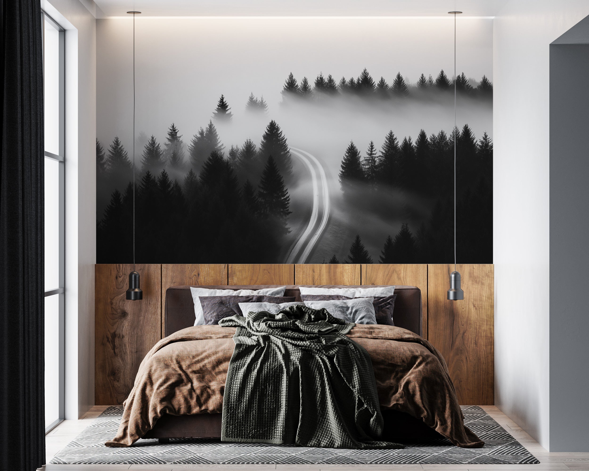 Monochrome misty forest road mural in a modern bedroom with a wooden headboard and black and white bedding, atmospheric foggy