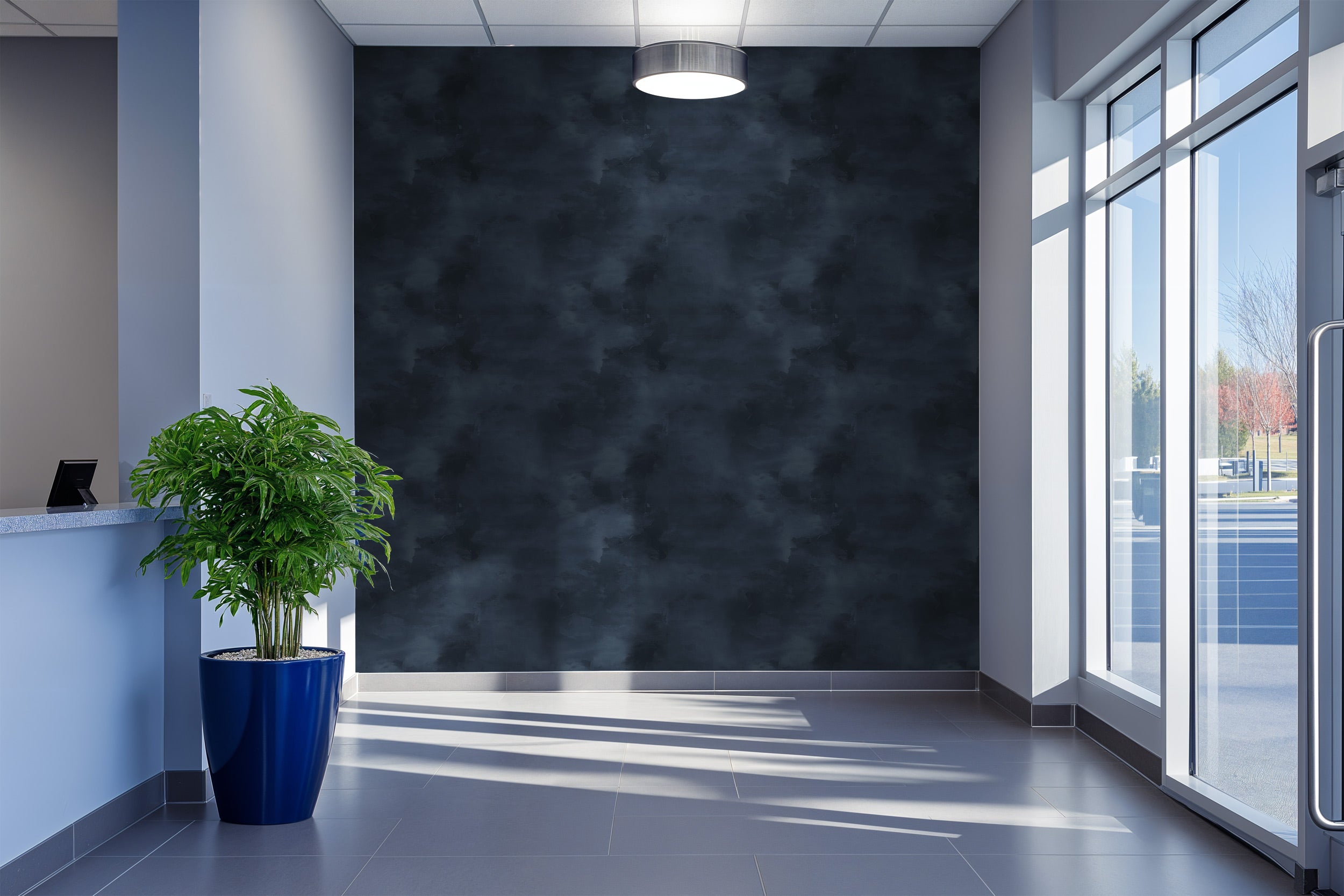 Navy blue abstract textured wallpaper look in a modern bedroom lobby with a large blue planter and floor-to-ceiling windows s