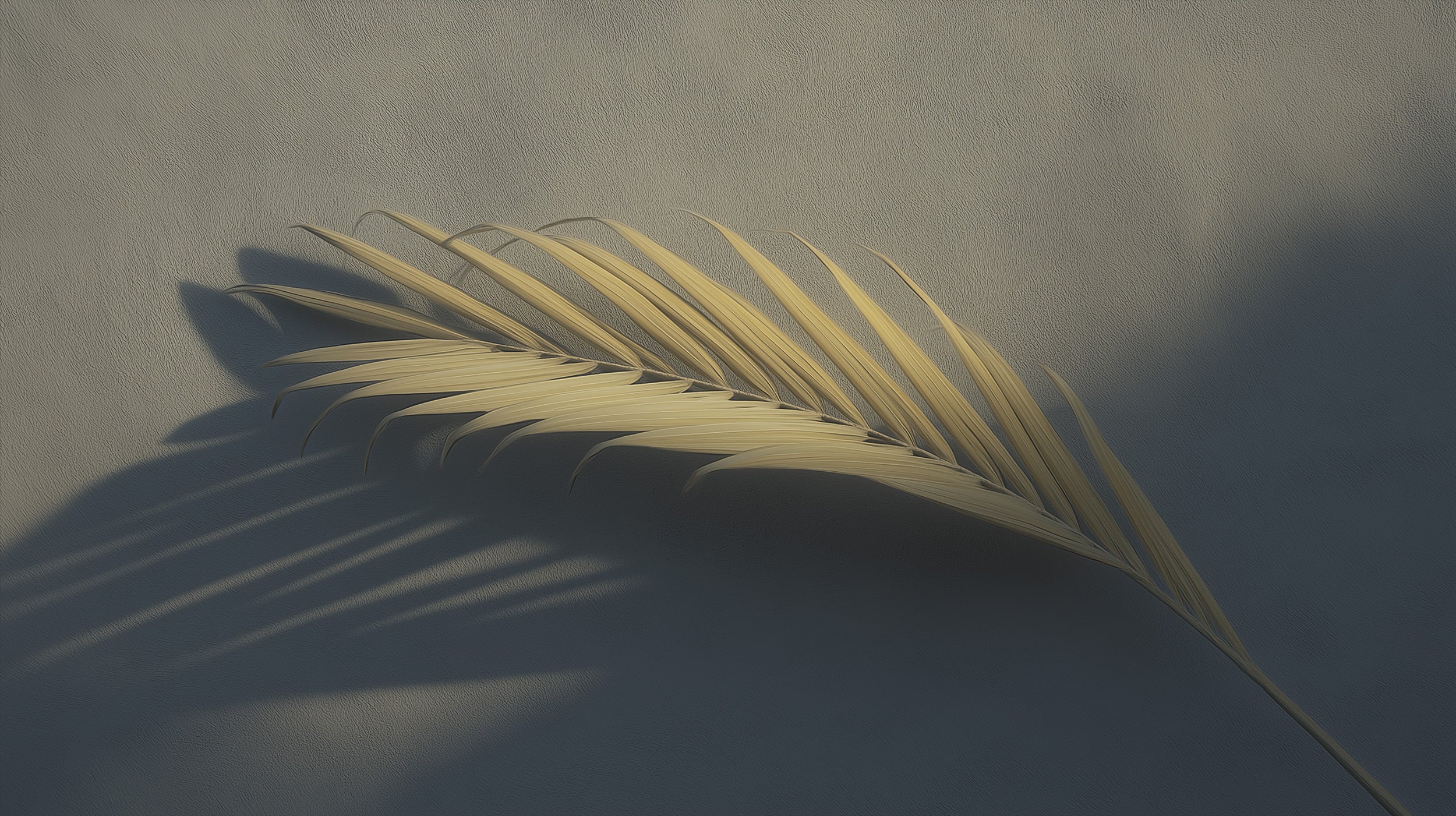 Golden palm leaf silhouette with dramatic shadows on neutral beige-gray wall, minimalist tropical wall art for modern interio