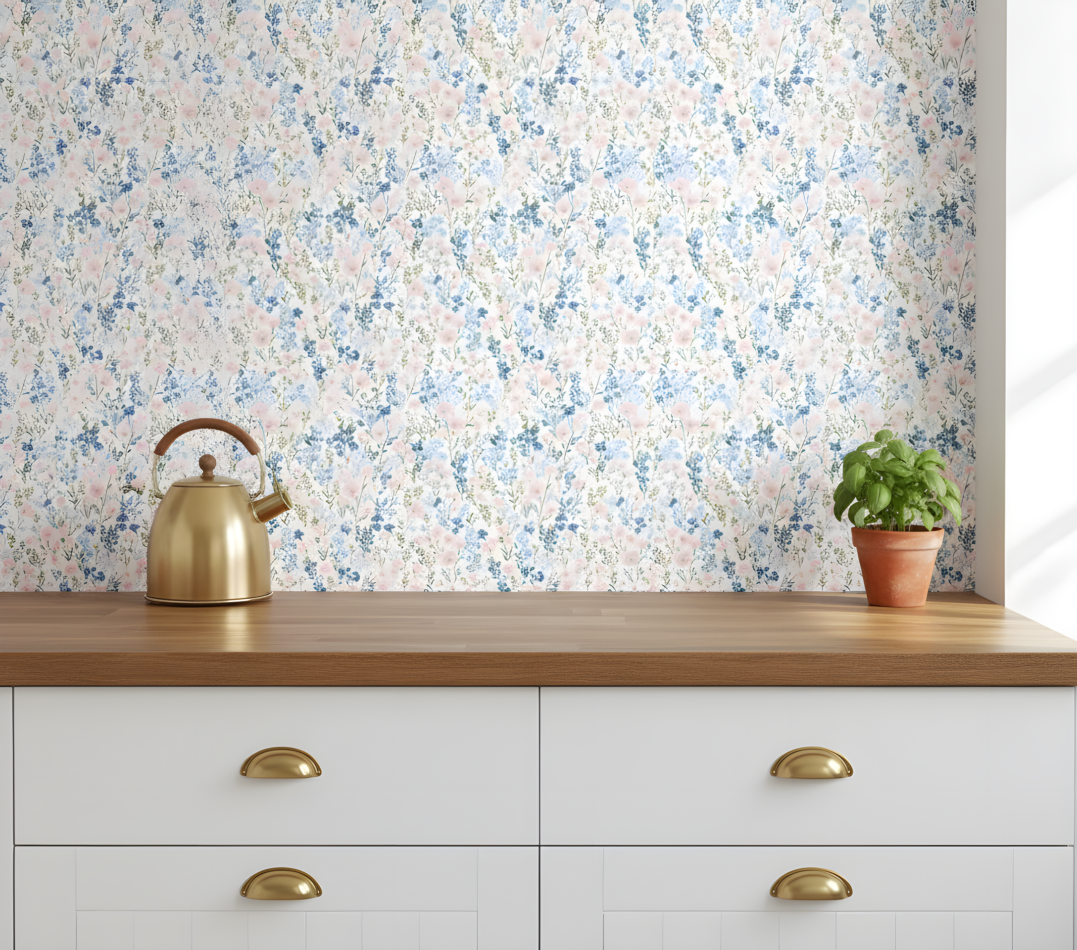 Peel and stick wallpaper with soft pink and blue wildflowers, green stems on white, displayed in a bright kitchen with a wood