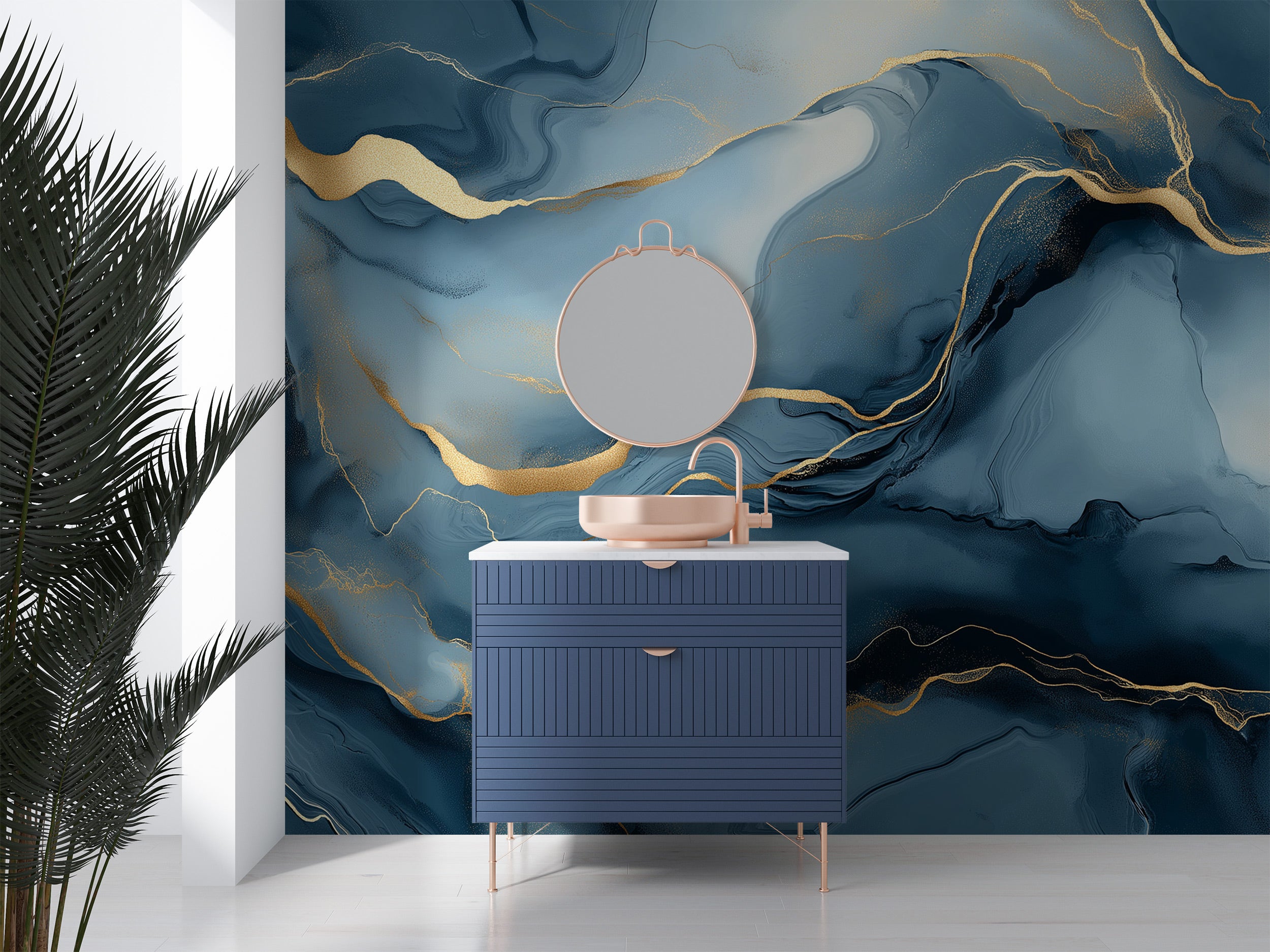 Blue abstract marble mural with gold veining wall behind navy vanity with round mirror and rose gold fixtures, modern removab