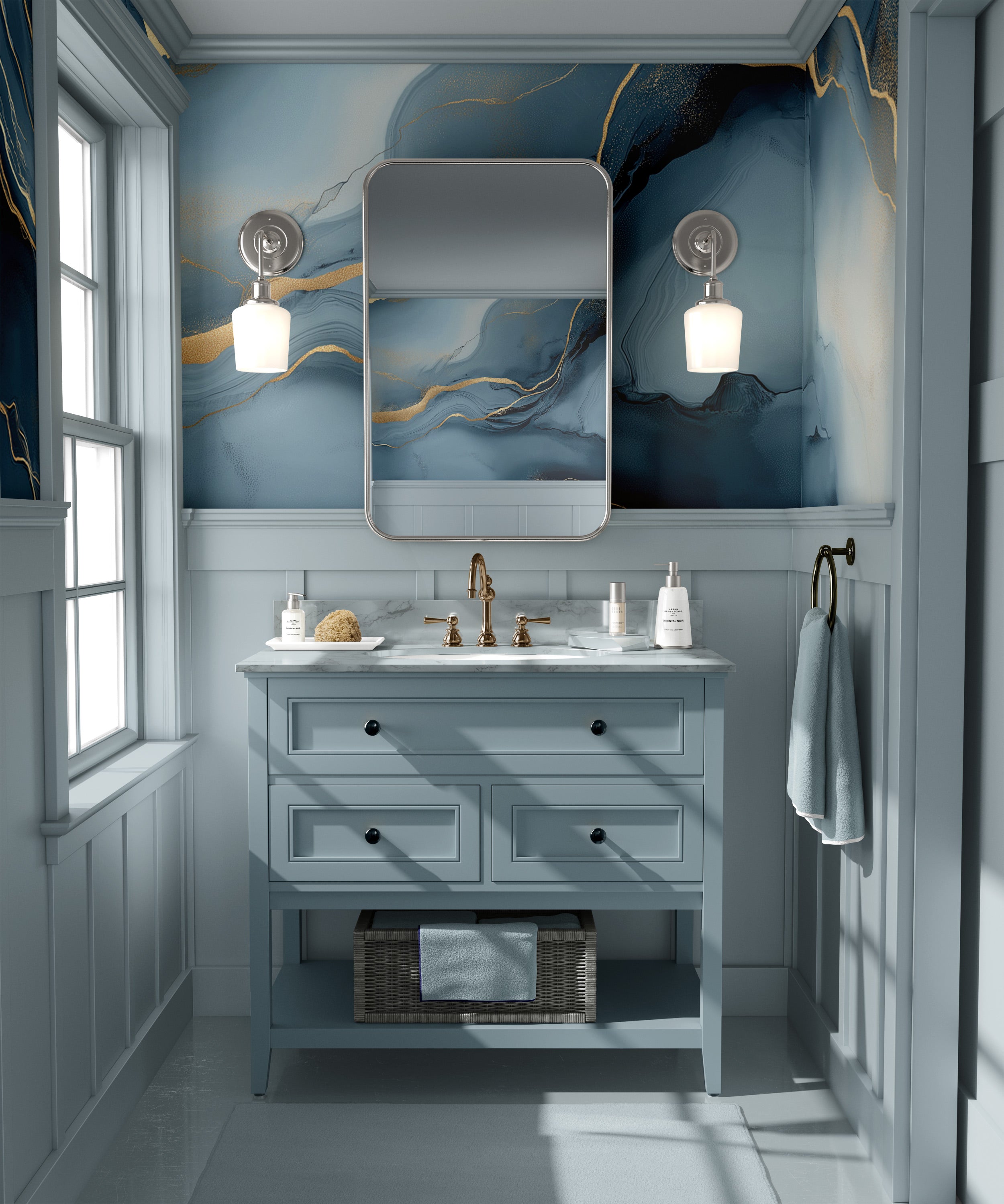 Blue abstract marble mural in a navy and soft blue bathroom with gold veining behind a light blue vanity and brass faucet, re