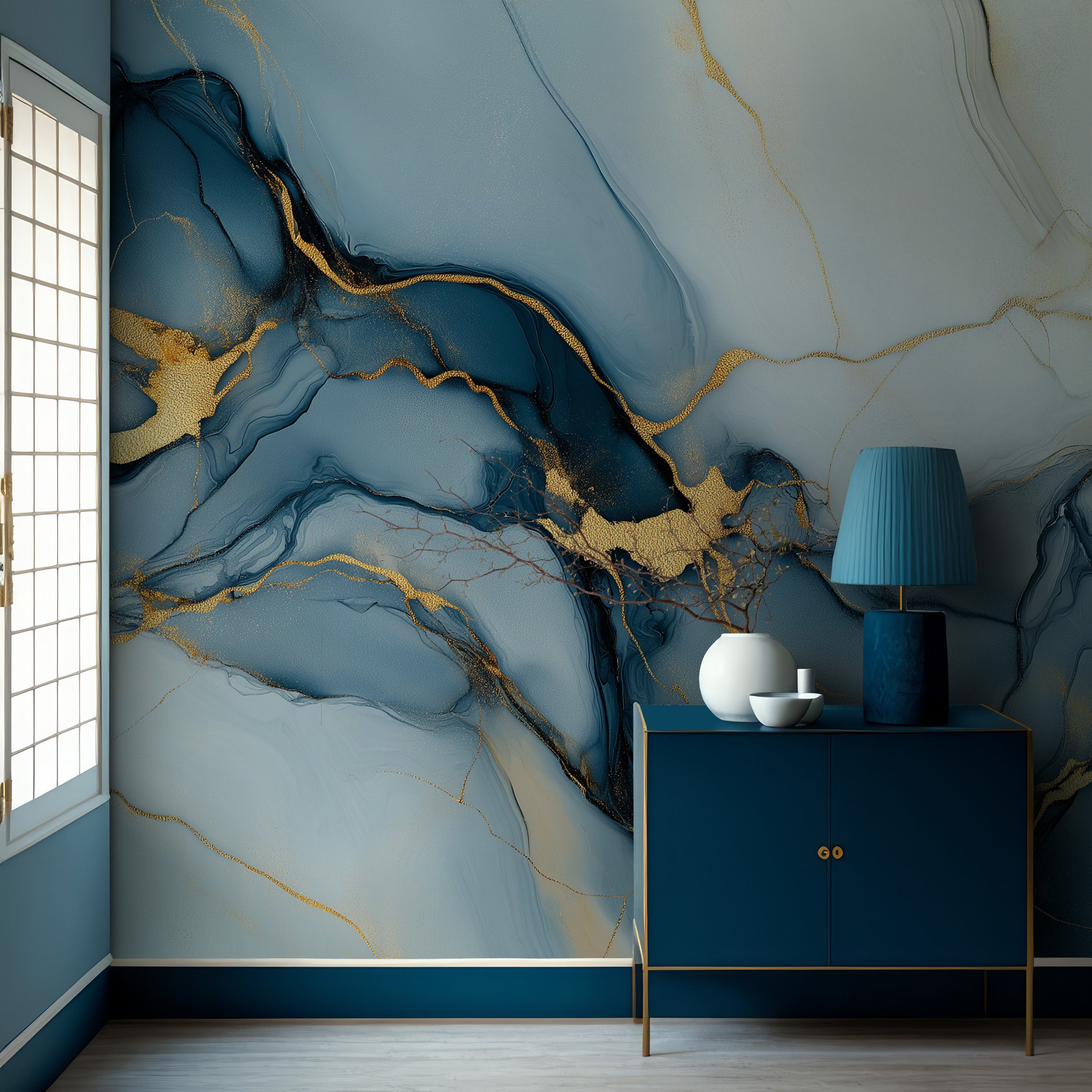 Blue gold abstract mural with flowing patterns in a modern blue room featuring a blue cabinet and gold accents