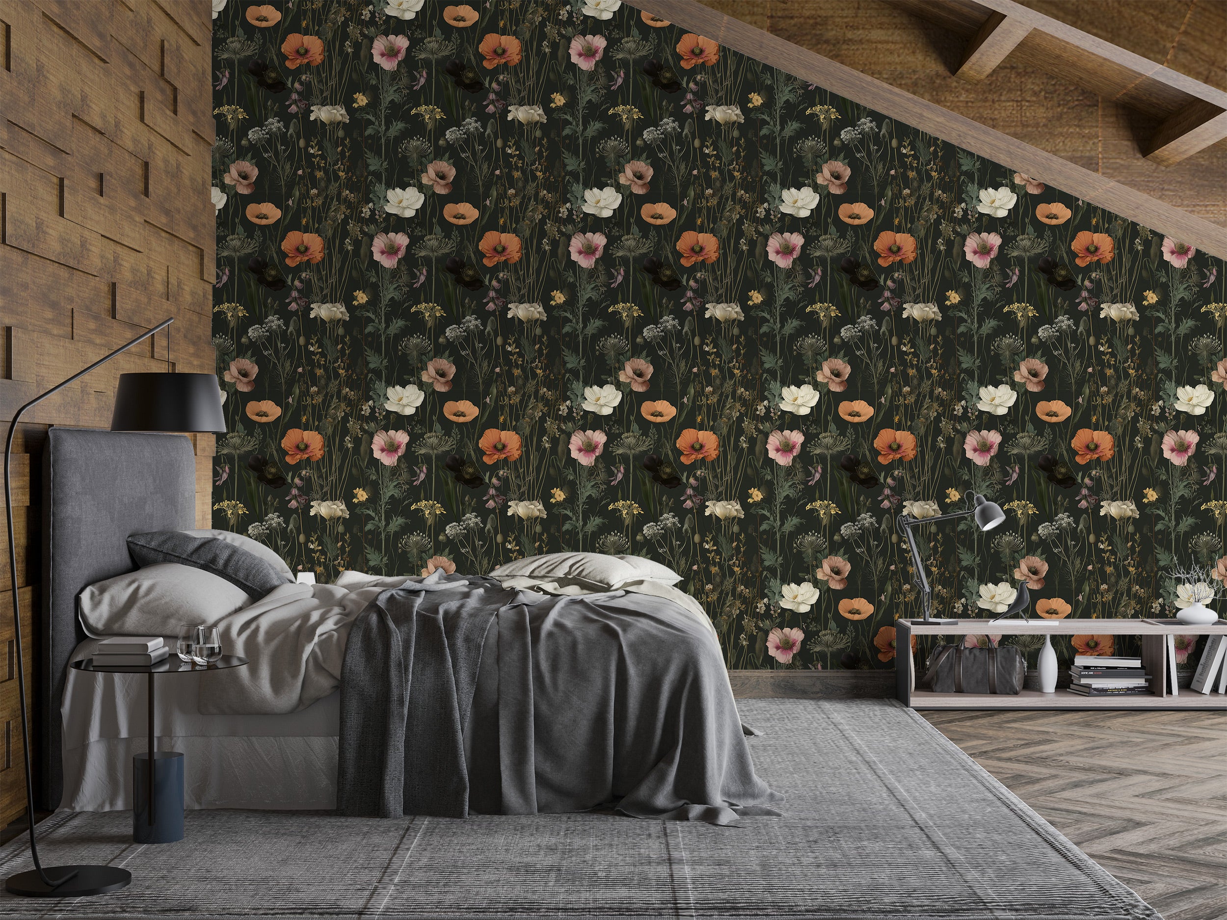 Dark moody floral wallpaper with orange pink white blooms in a stylish bedroom with a slanted ceiling and a cozy bed setup