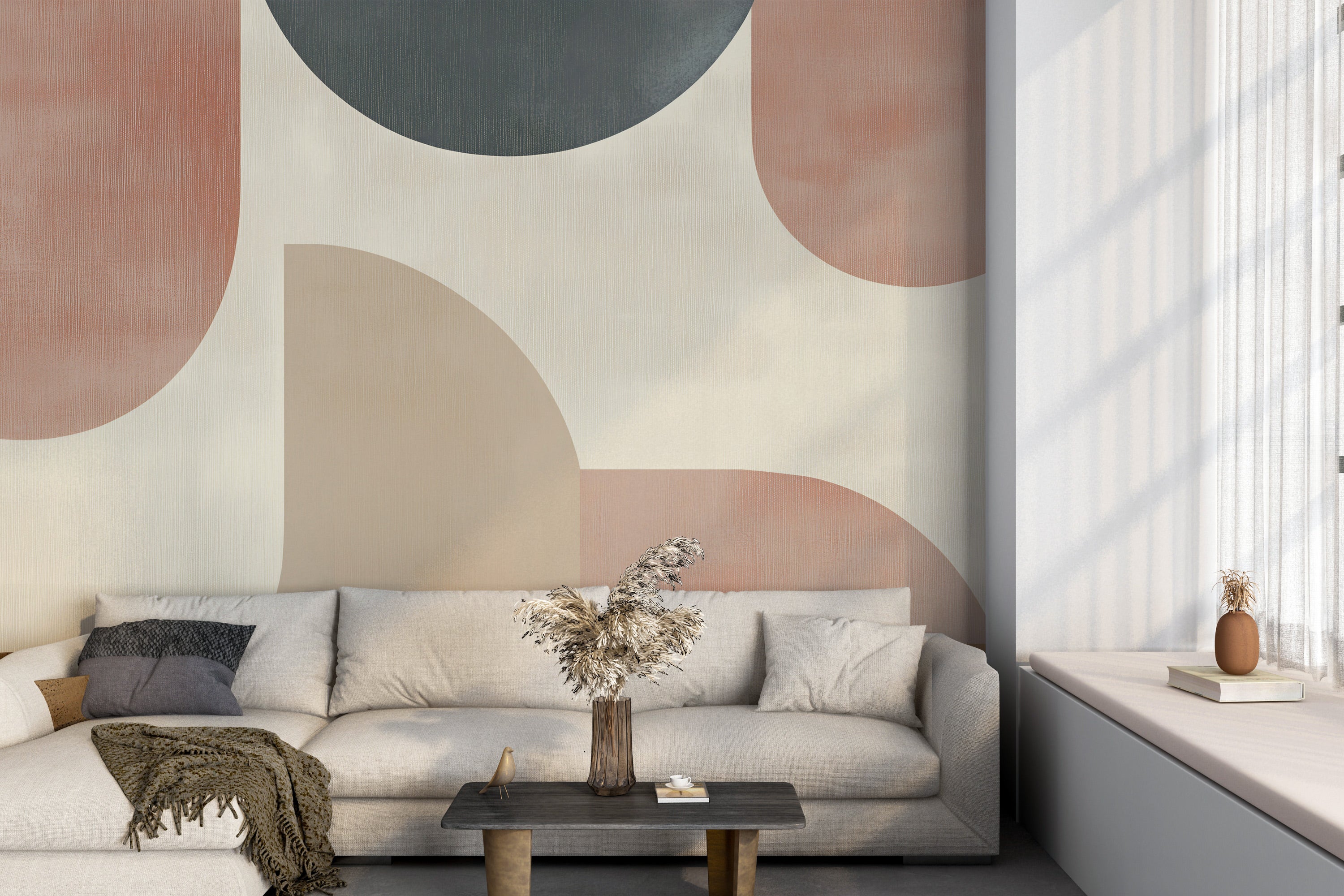 Abstract geometric mural in terracotta, charcoal, and beige tones on living room wall behind a neutral sofa with natural deco