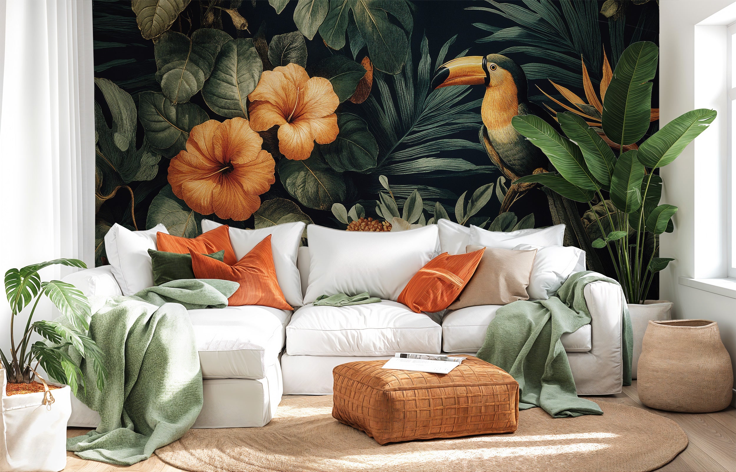 Tropical toucan mural living room scene with hibiscus blossoms, green foliage, and bold orange pillows on a white sofa in a l